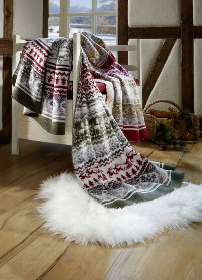 Kuschelige Wohndecke mit winterlichen Motiven 